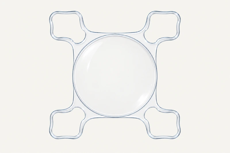 Monofocal AddOn with a smooth central optic and four closed-loop supports.