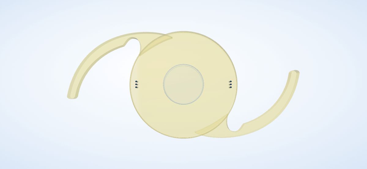 An illustrative EDOF intraocular lens with a smooth central optical zone, curved supporting arms, yellow tint and toric axis marks